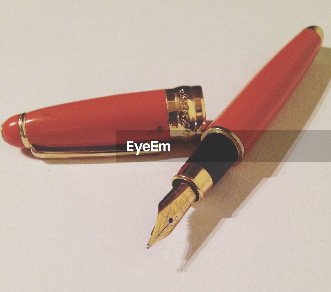 CLOSE-UP OF RED OBJECT ON TABLE