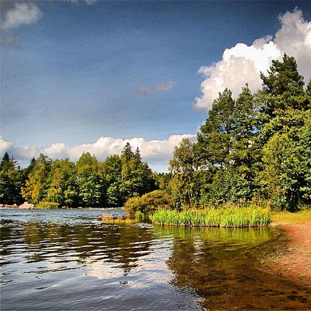 SCENIC VIEW OF LAKE WITH MOUNTAIN IN BACKGROUND