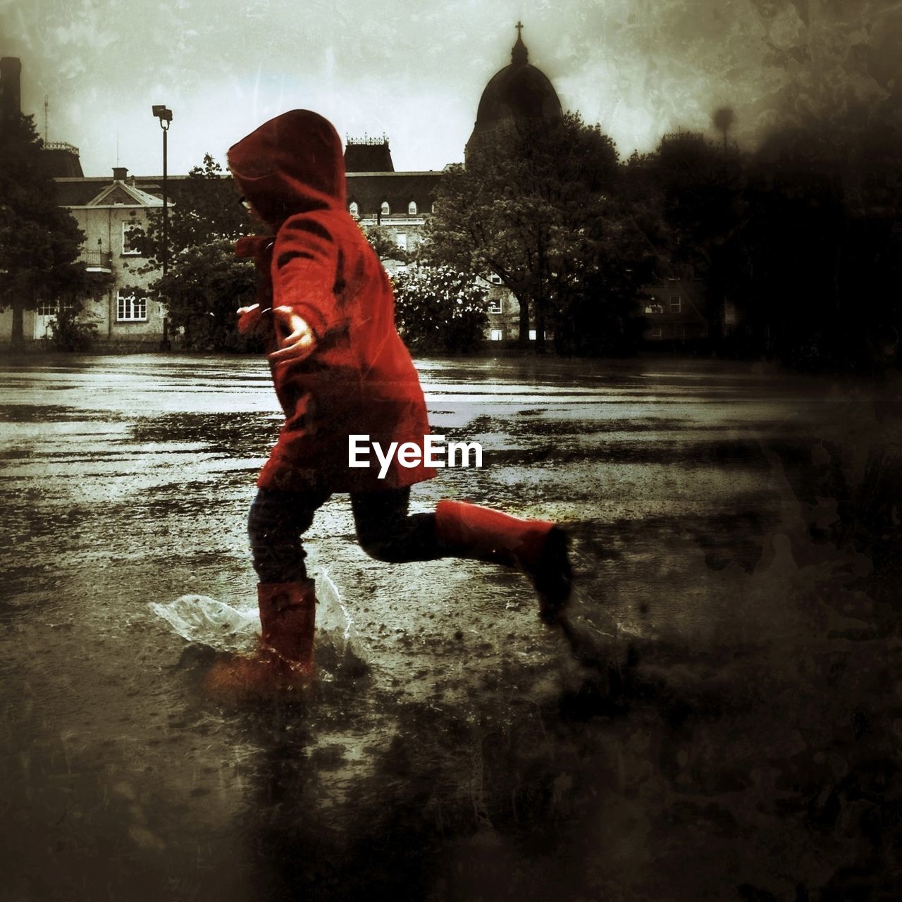 Full length of child running in rain