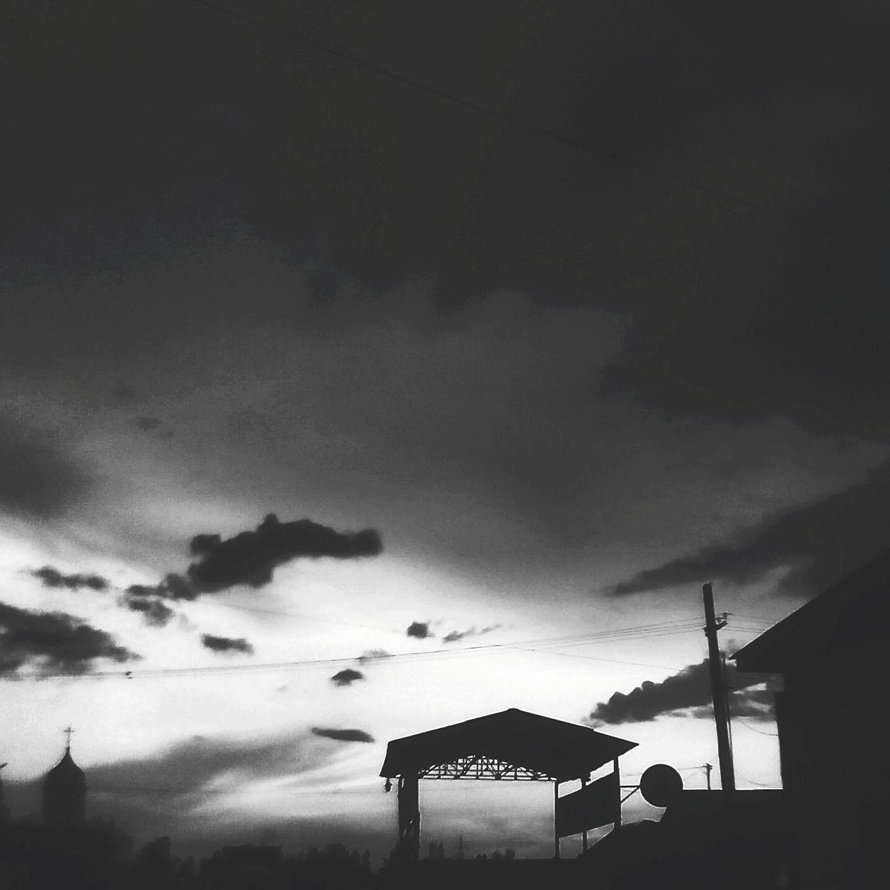 LOW ANGLE VIEW OF ROOF AGAINST CLOUDY SKY