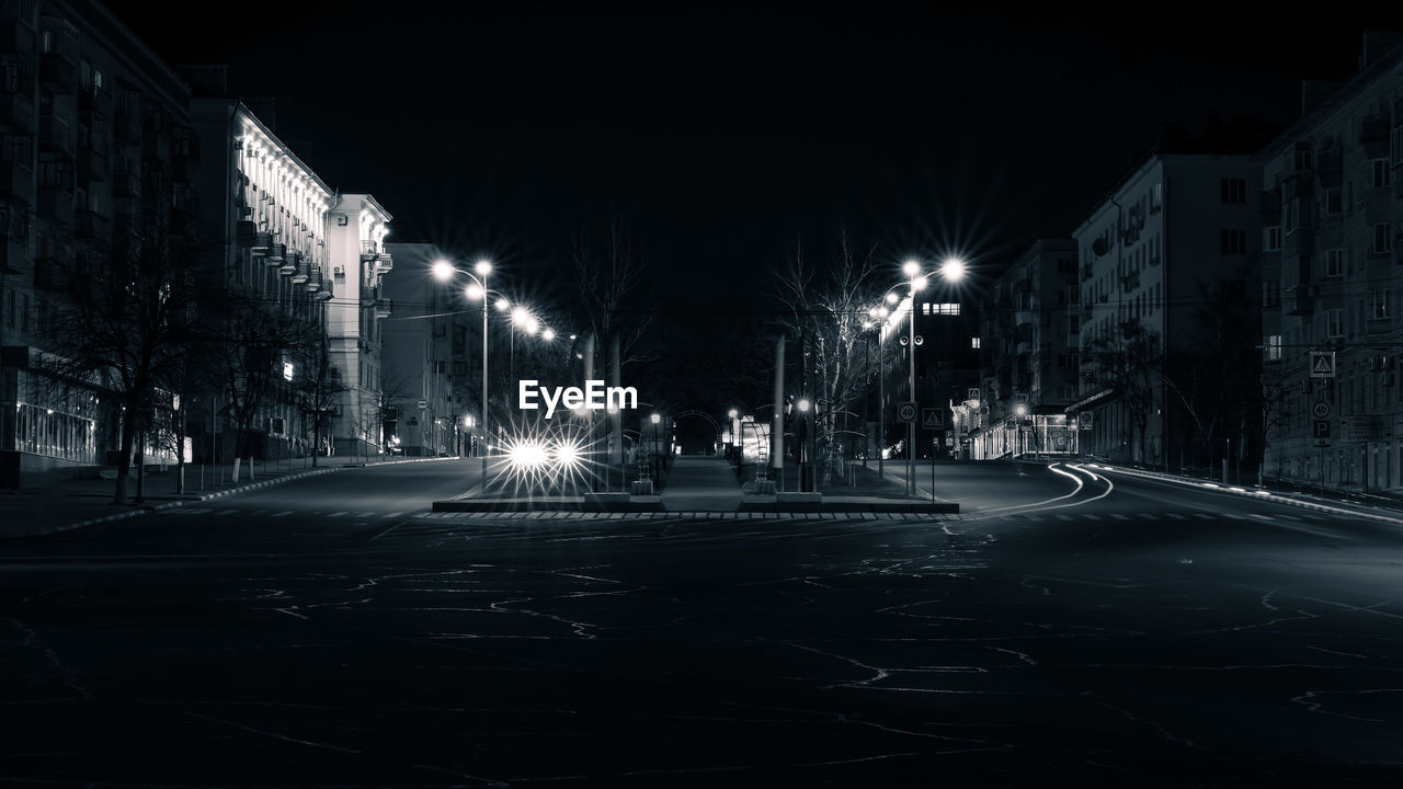 ILLUMINATED STREET AT NIGHT