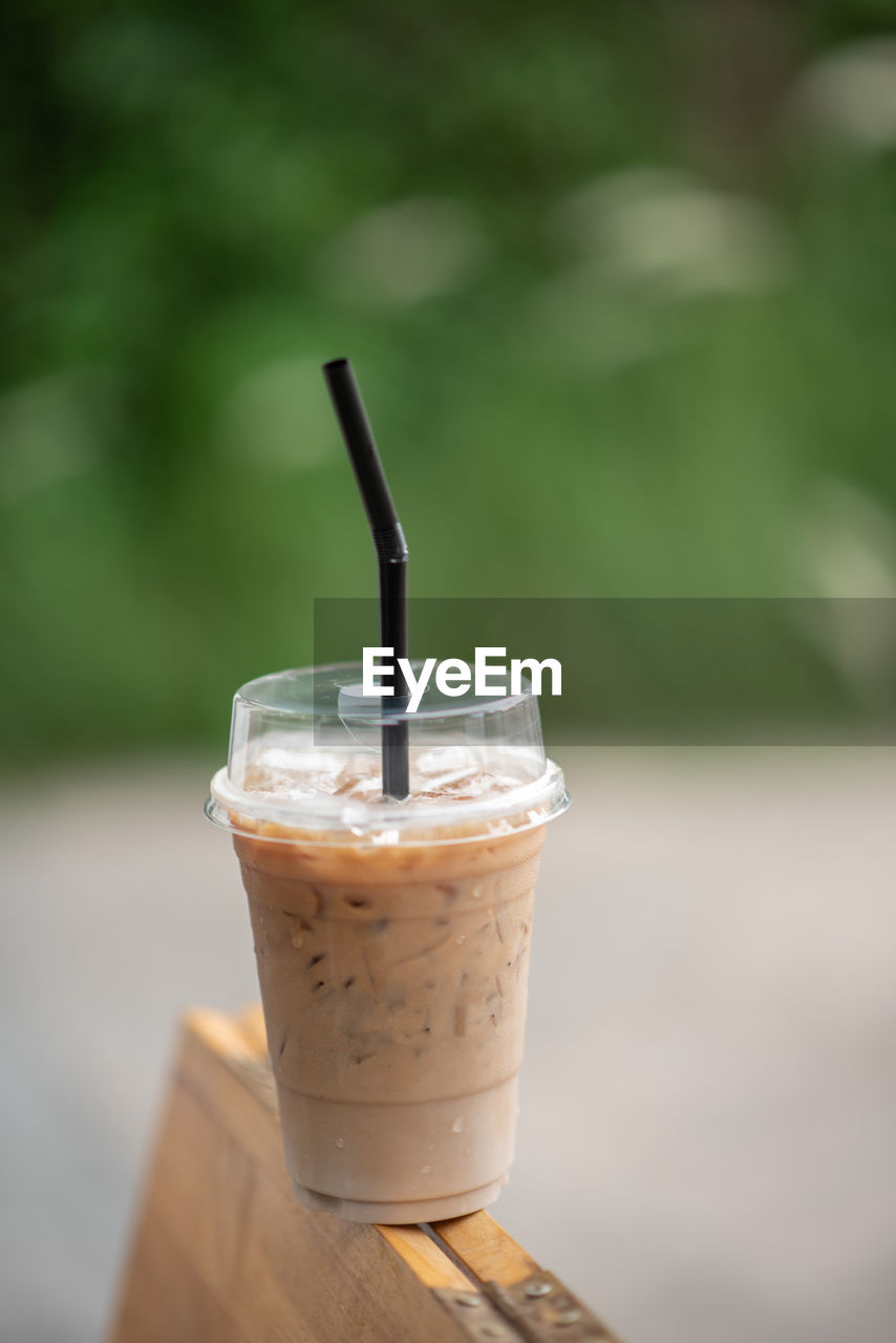 CLOSE-UP OF COFFEE CUP ON TABLE