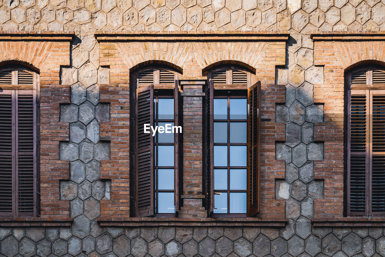 LOW ANGLE VIEW OF WEATHERED BUILDING