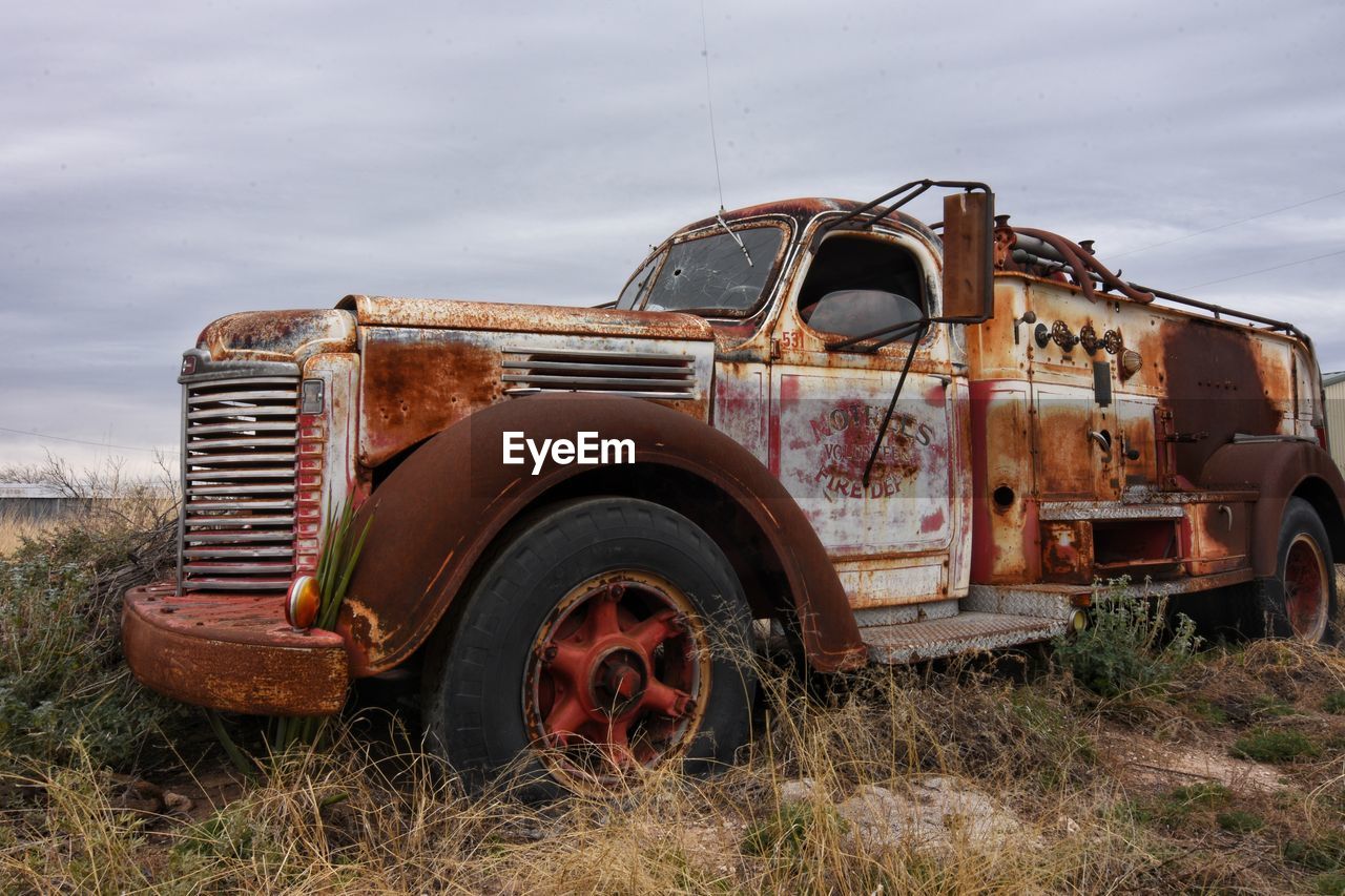 ABANDONED TRUCK ON FIELD