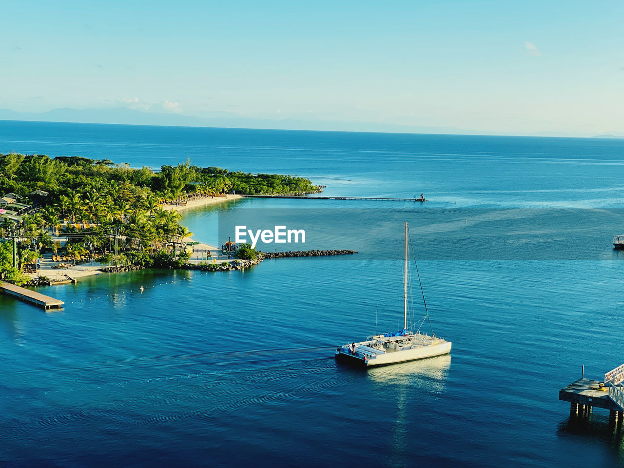 High angle view of sailboats in sea against sky