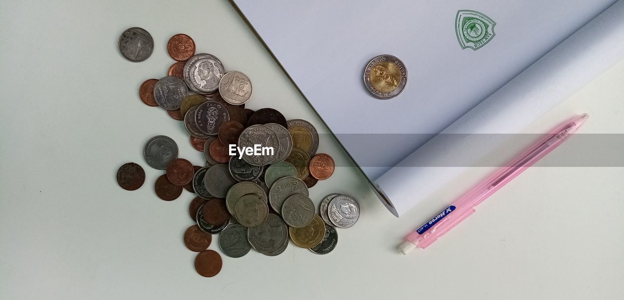 High angle view of coins on table