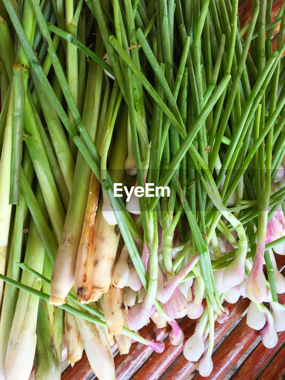 High angle view of spring onions on table