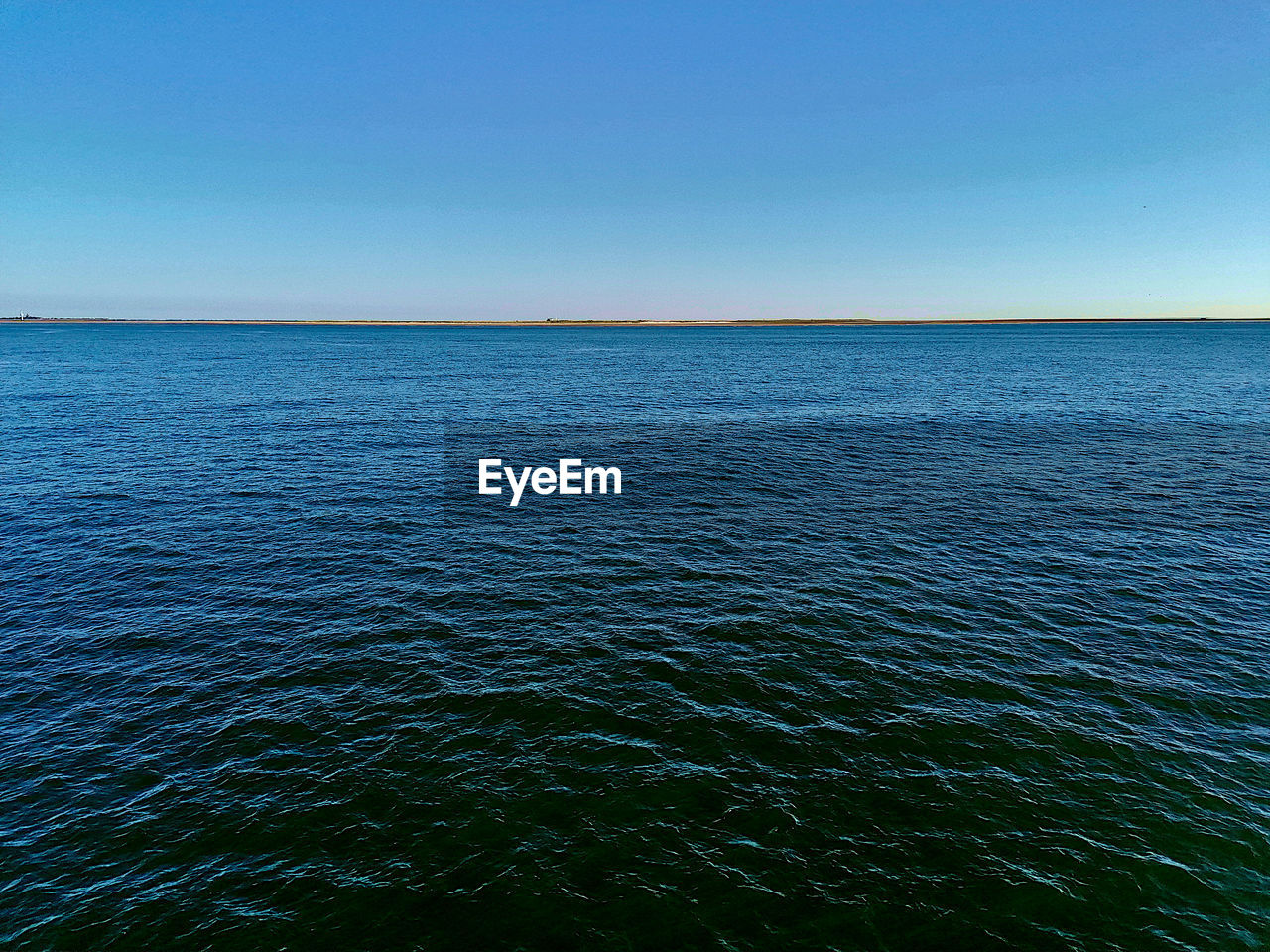 SCENIC VIEW OF SEA AGAINST BLUE SKY