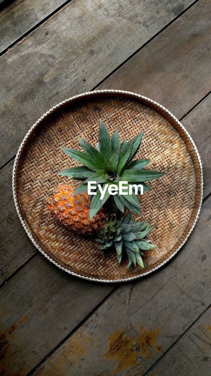 Fresh pineapple on weaving tray 