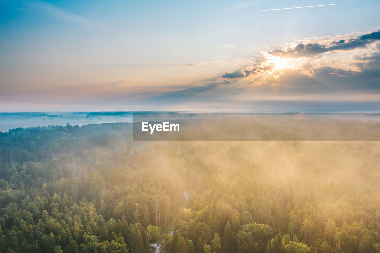 Scenic view of land against sky during sunset