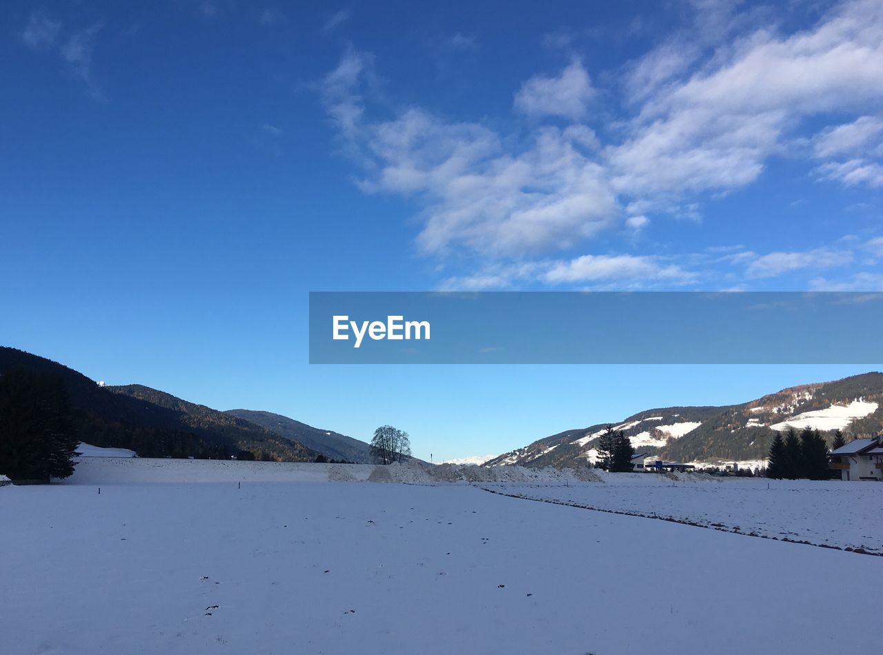 SCENIC VIEW OF MOUNTAINS AGAINST BLUE SKY