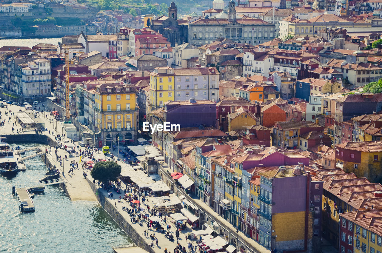 Aerial view of cityscape next to water