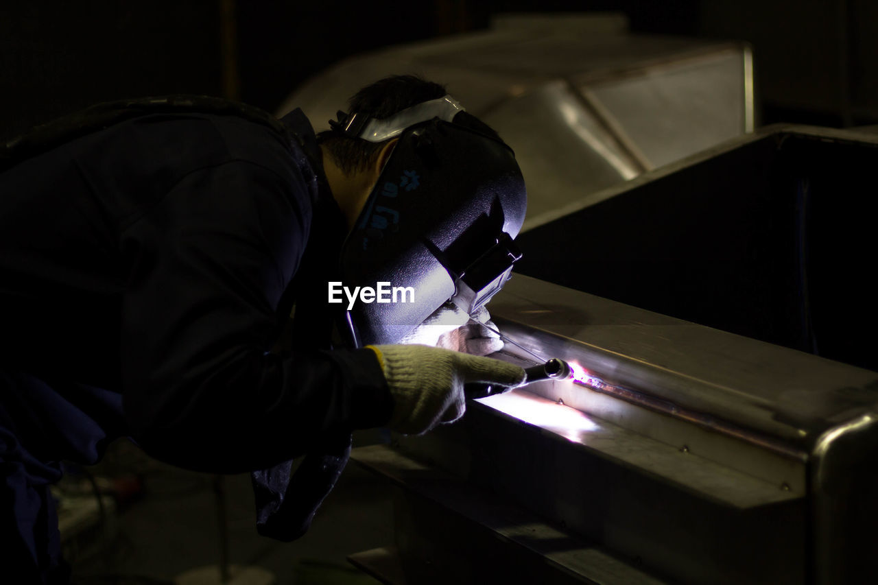 Man working on metal in workshop