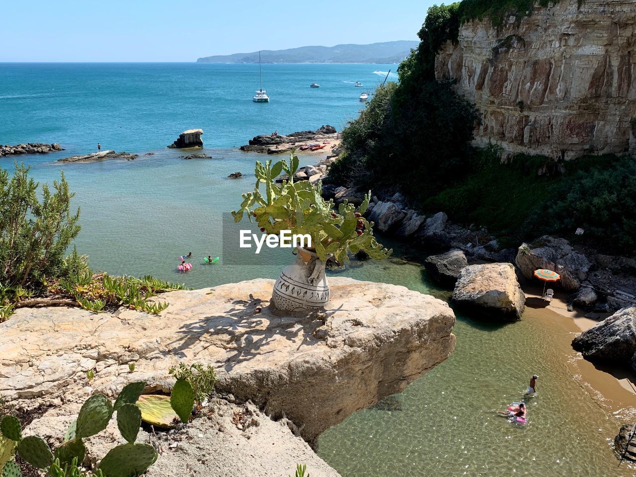 High angle view of rocks on beach against sky