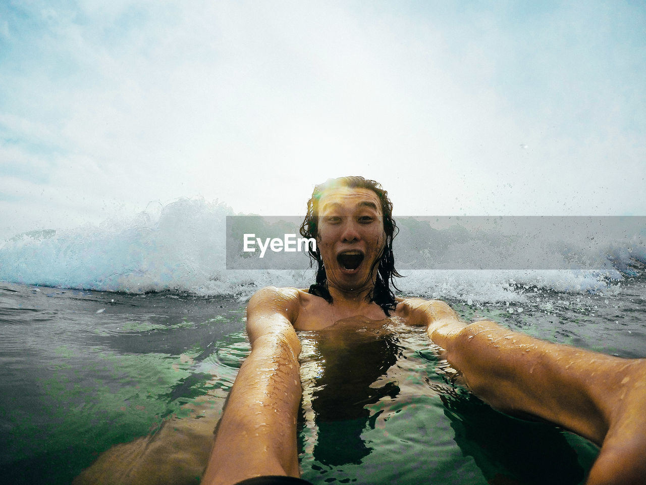 Portrait of man swimming in sea