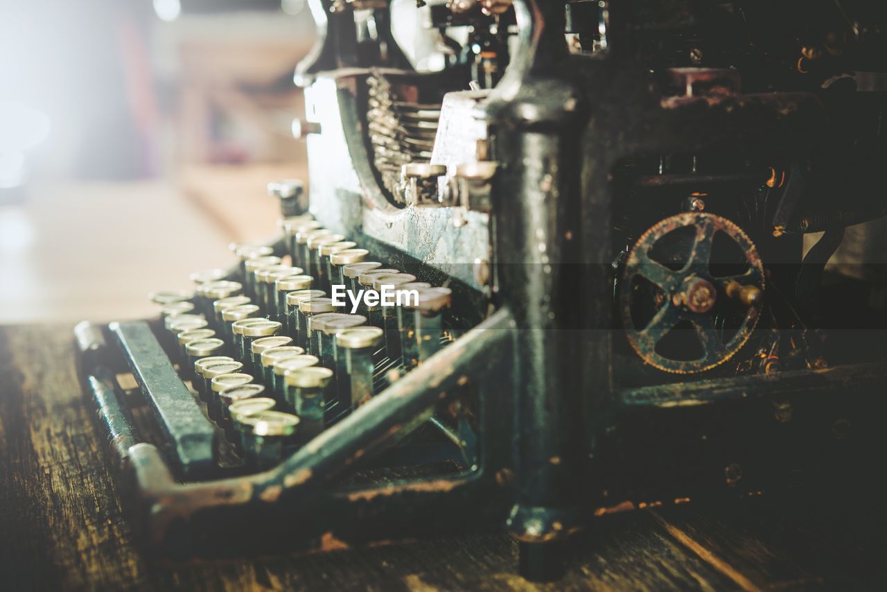 Close-up of old typewriter on table