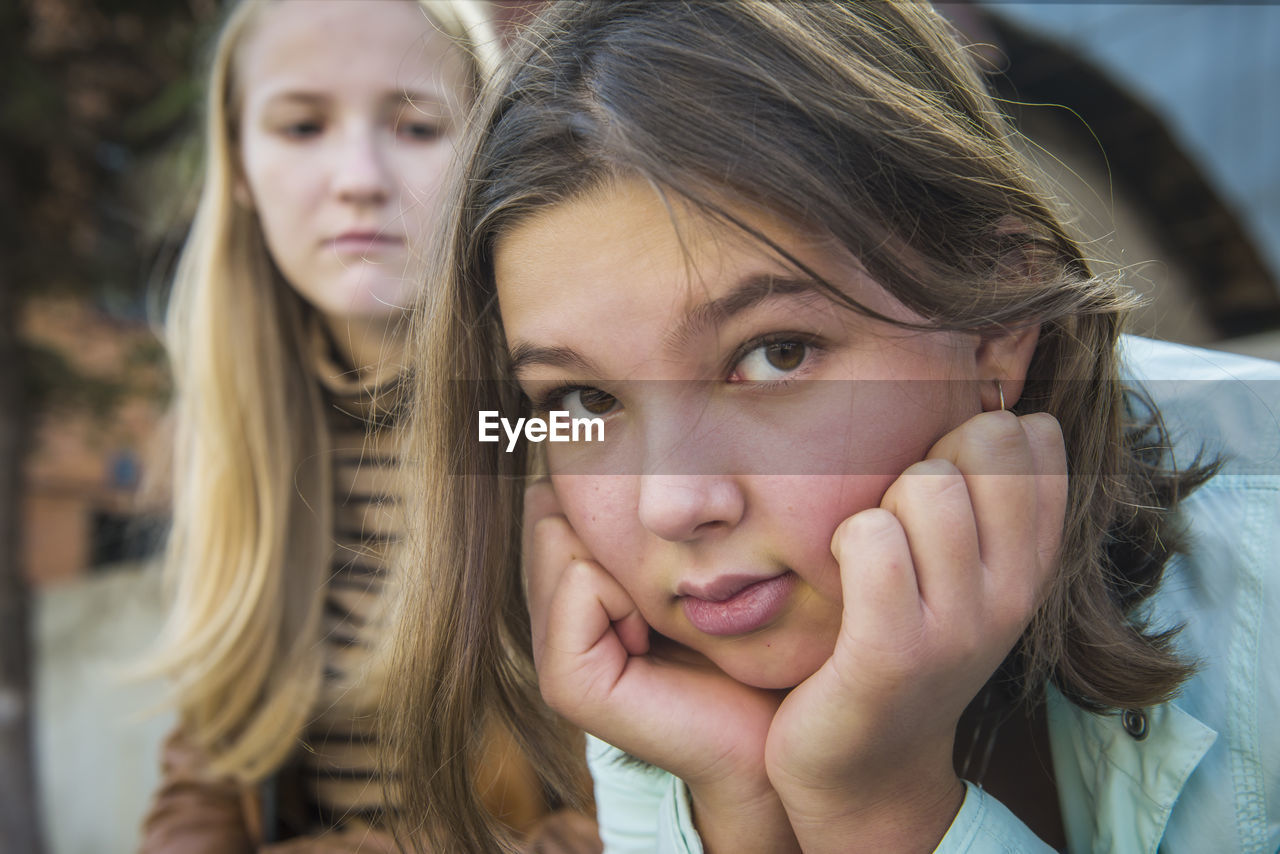 Close-up of teenage girl with friend