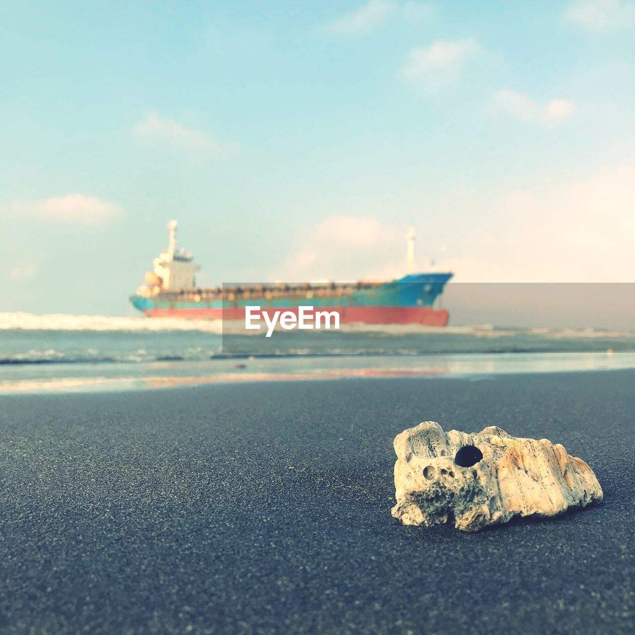 SHIP ON BEACH AGAINST SKY