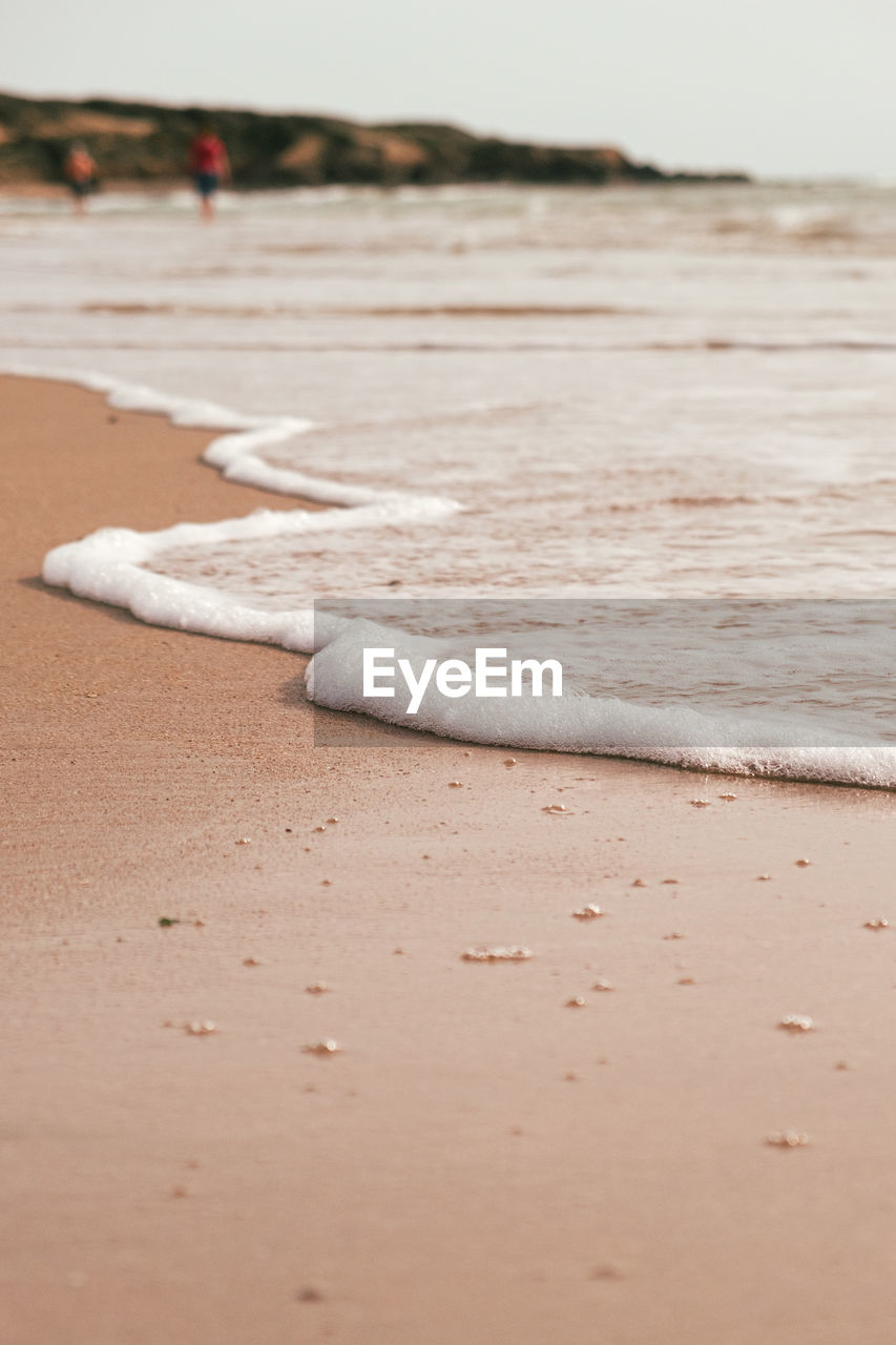 CLOSE-UP OF CIGARETTE ON SAND