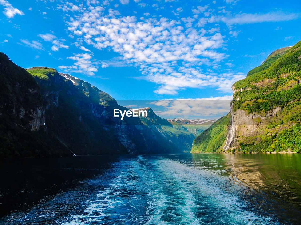 Scenic view of lake against blue sky