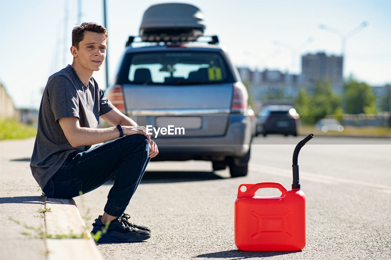 MAN SITTING IN CAR