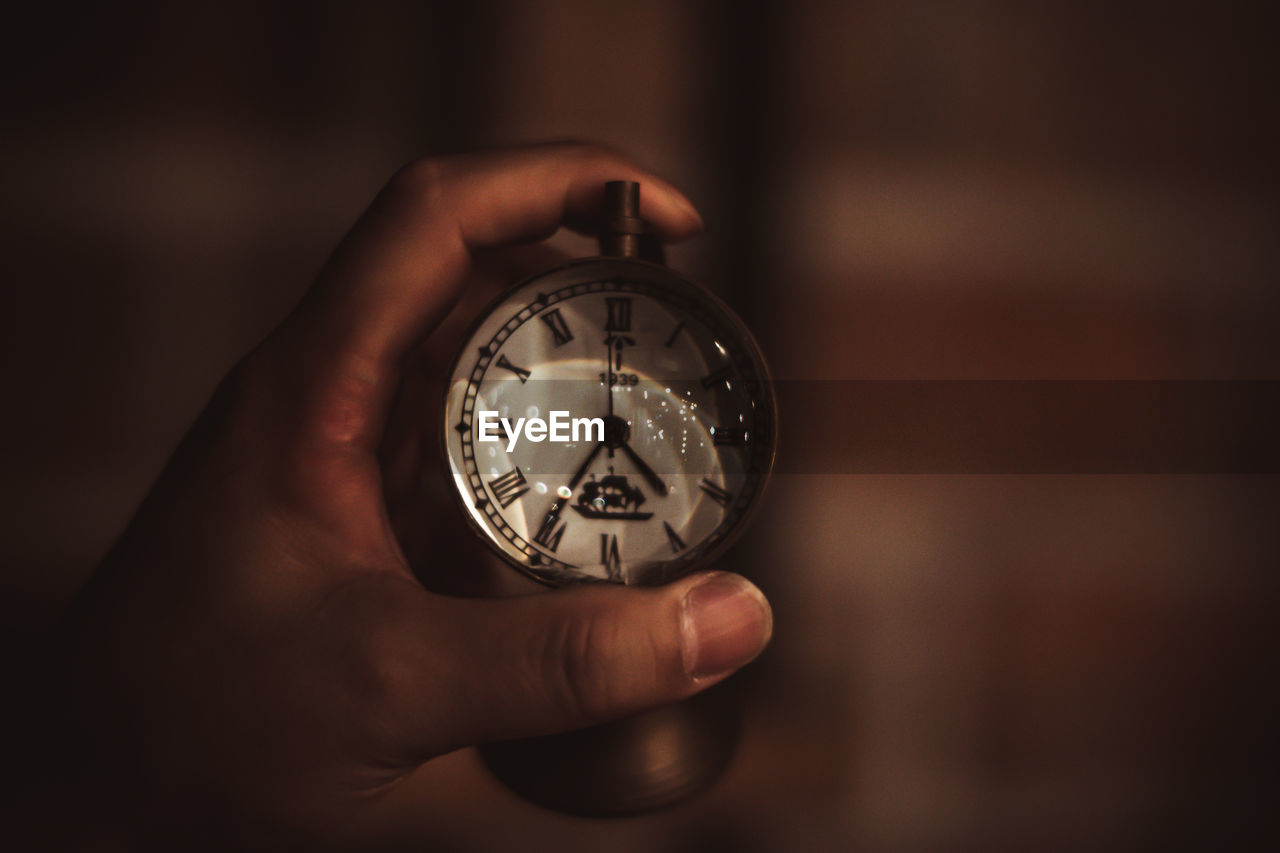 Close-up of hand holding stopwatch