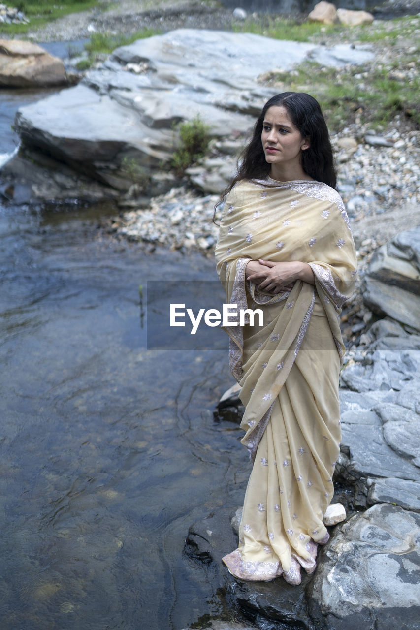 WOMAN LOOKING AWAY IN WATER