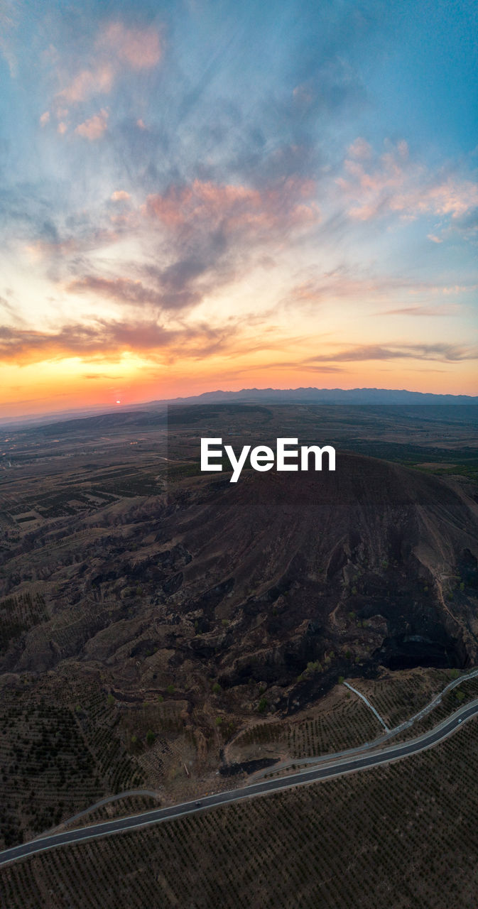 Scenic view of landscape against sky during sunset