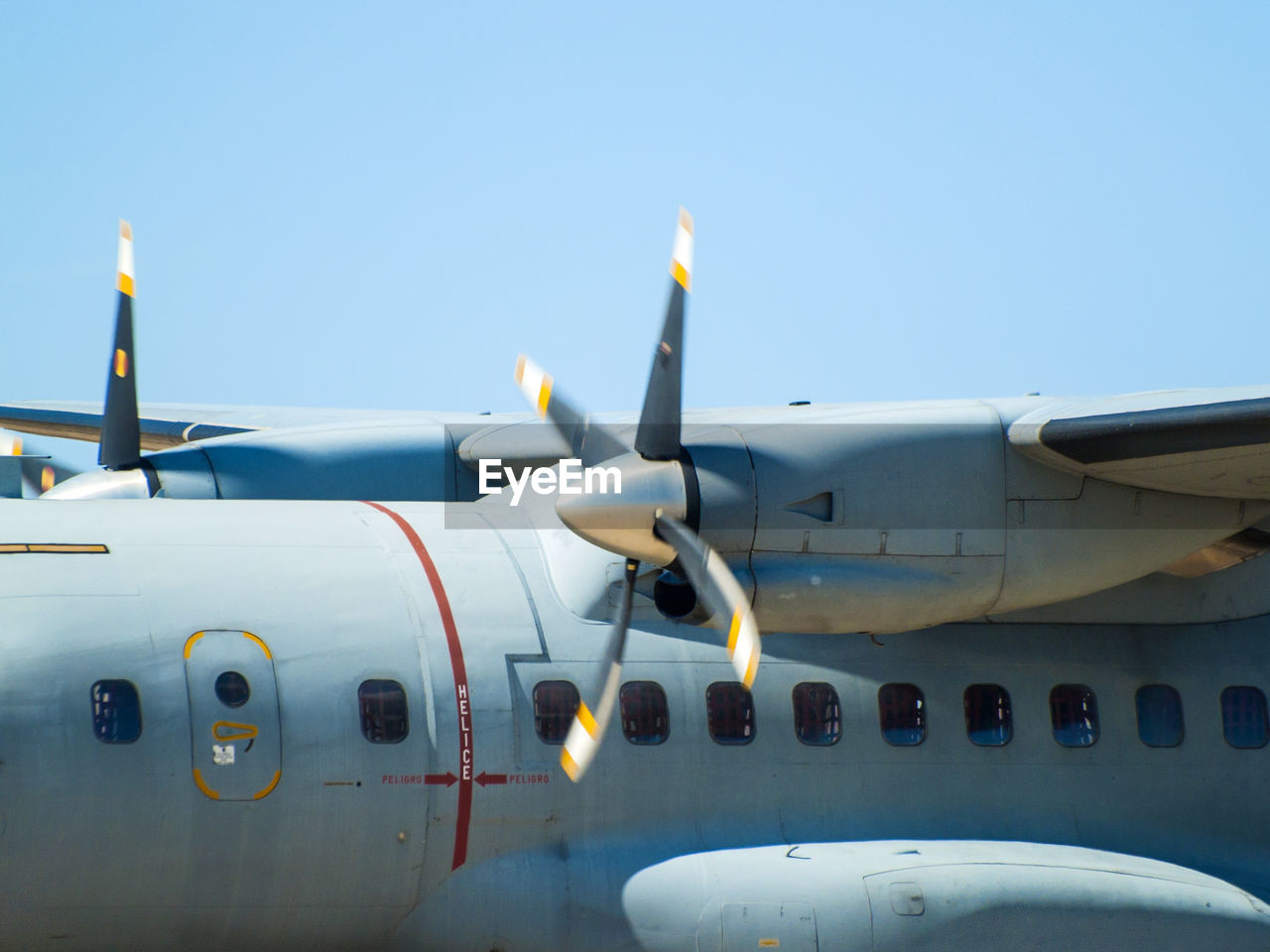 CLOSE-UP OF AIRPLANE AGAINST CLEAR SKY