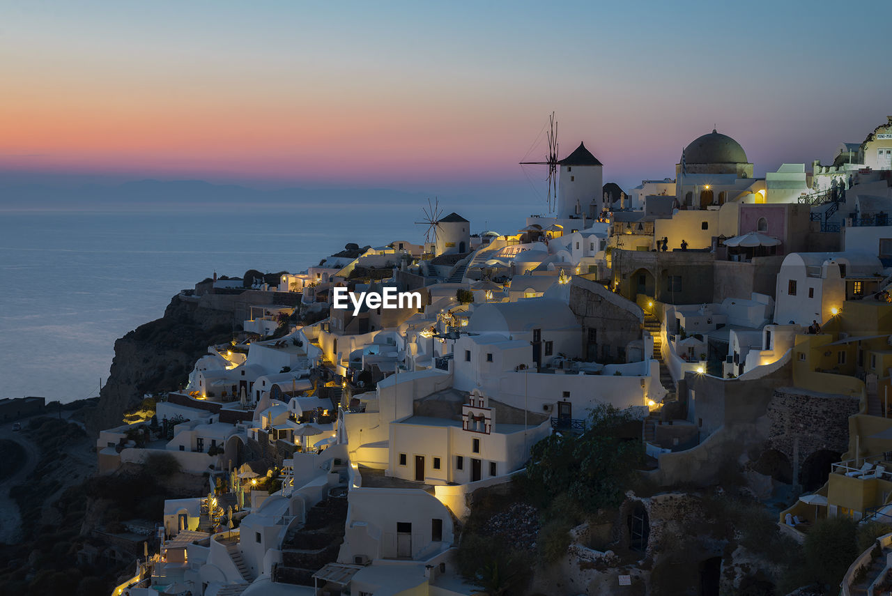 Buildings in town at sunset