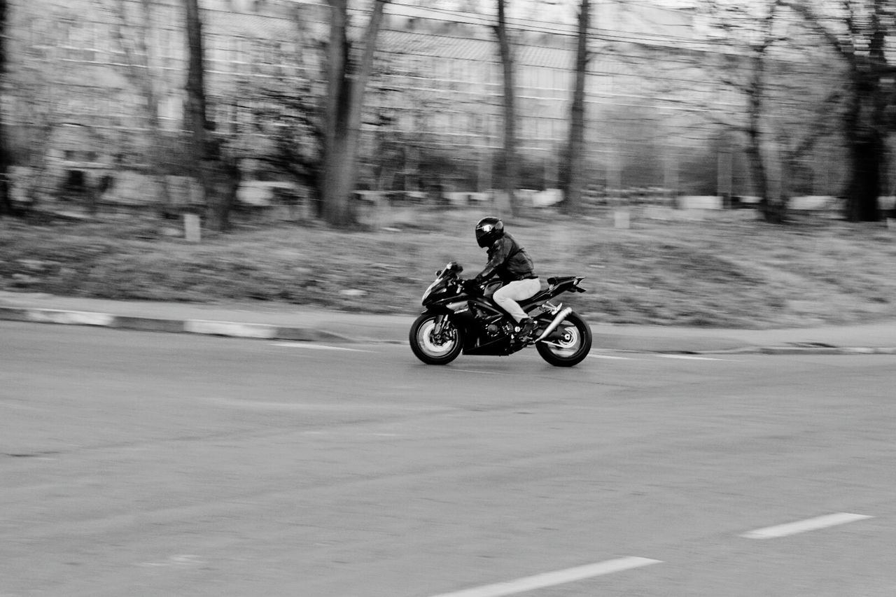 MAN RIDING BICYCLE ON A CART