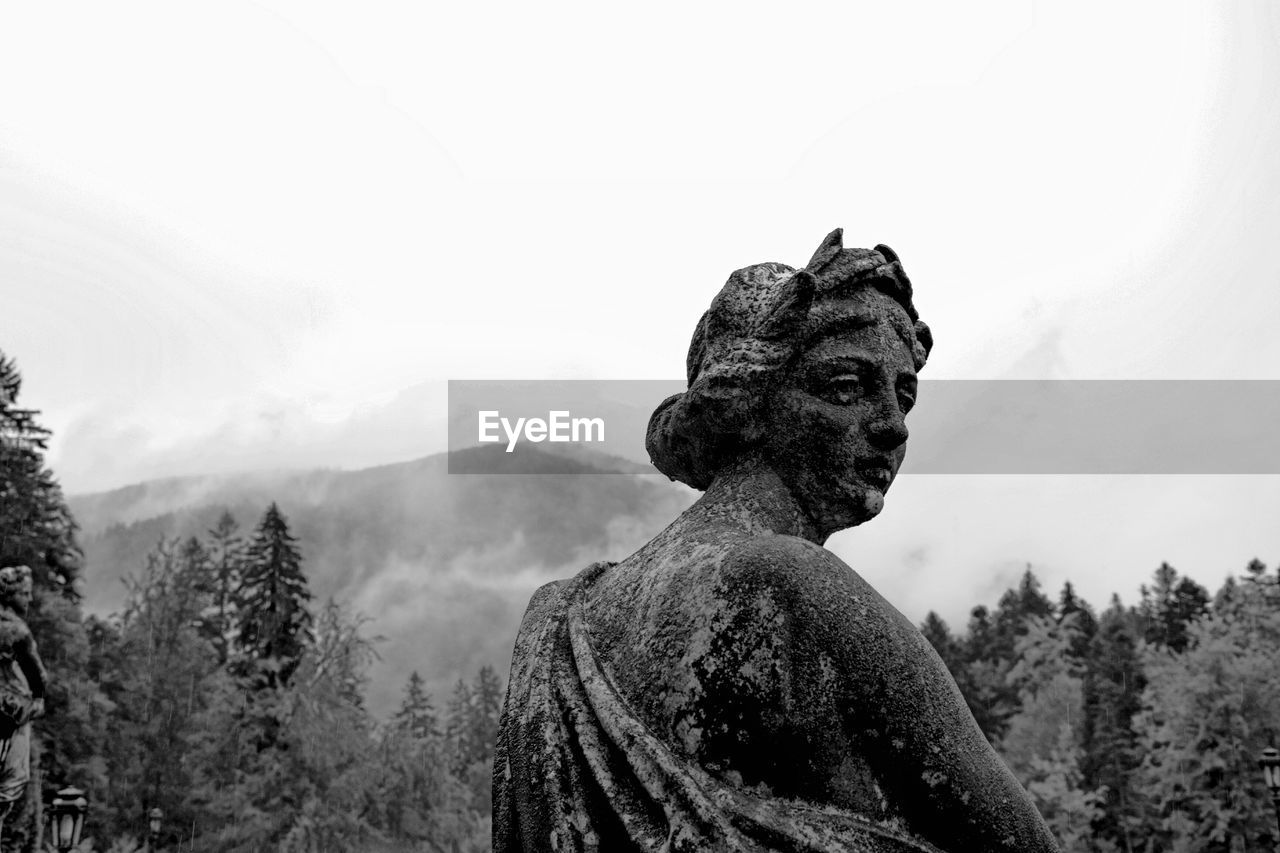 Low angle view of statue against sky