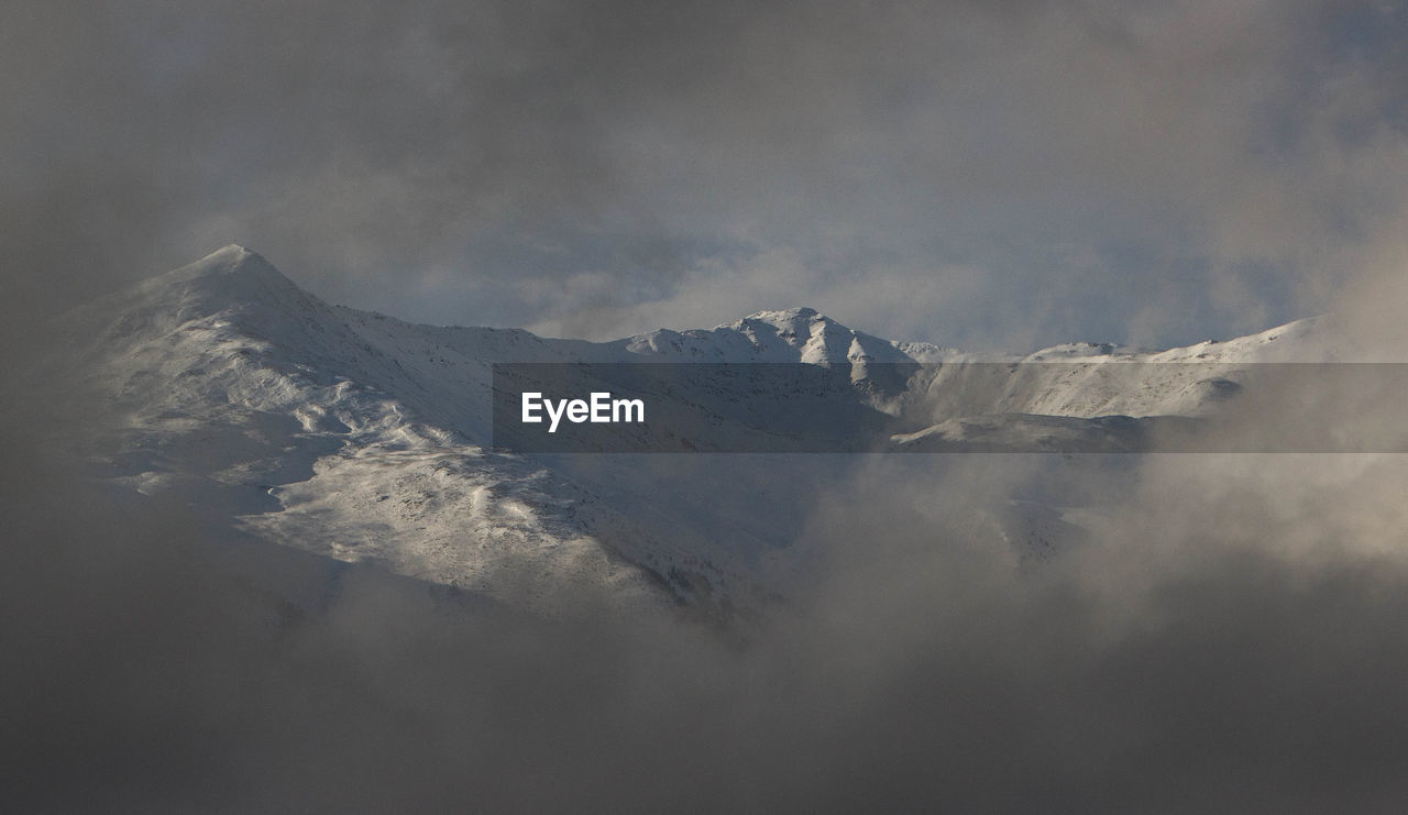 Scenic view of mountain against sky during winter