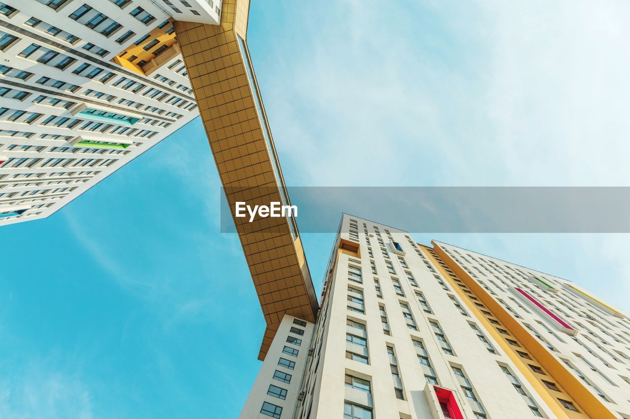 Low angle view of modern buildings against sky