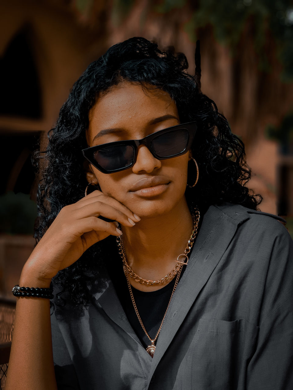 Portrait of young woman wearing sunglasses