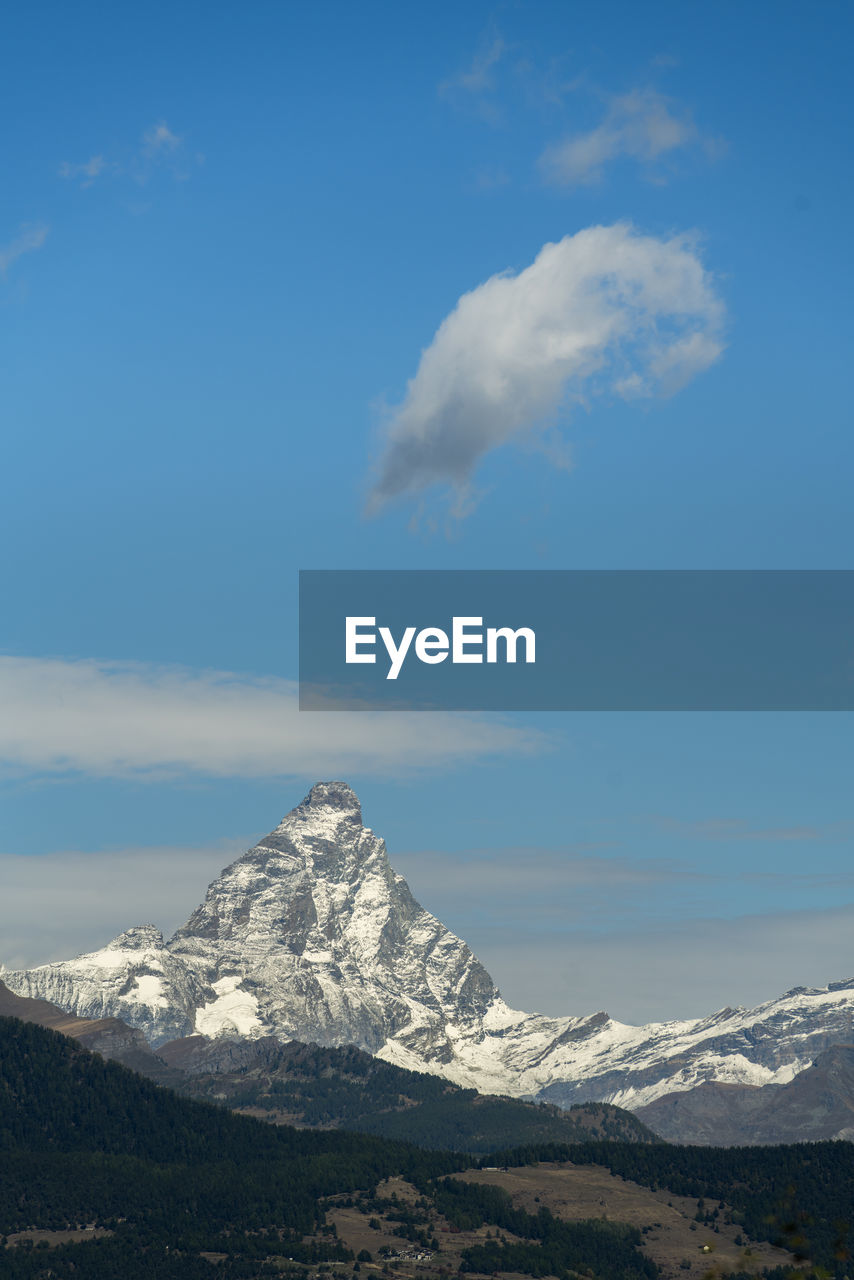 mountain, snow, sky, cold temperature, winter, cloud, scenics - nature, snowcapped mountain, beauty in nature, environment, mountain range, landscape, nature, mountain peak, no people, plateau, tranquil scene, travel destinations, blue, travel, day, tranquility, outdoors, summit, land, non-urban scene, stratovolcano