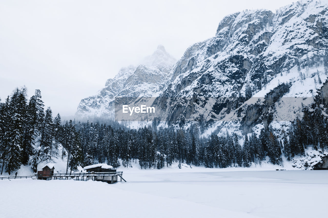 Scenic view of snow covered mountains against sky