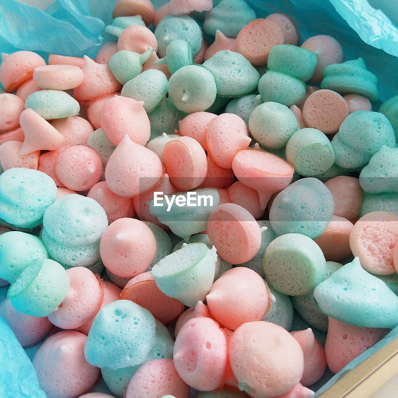 HIGH ANGLE VIEW OF MULTI COLORED CANDIES IN CONTAINER