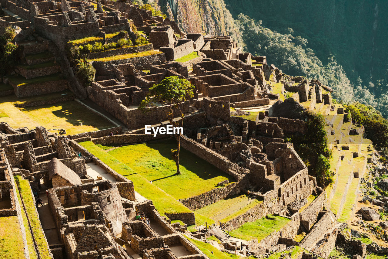 Machu picchu old inca ruins at sunrise in peru