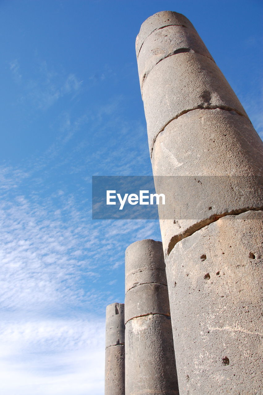 LOW ANGLE VIEW OF SMOKE STACKS AGAINST SKY