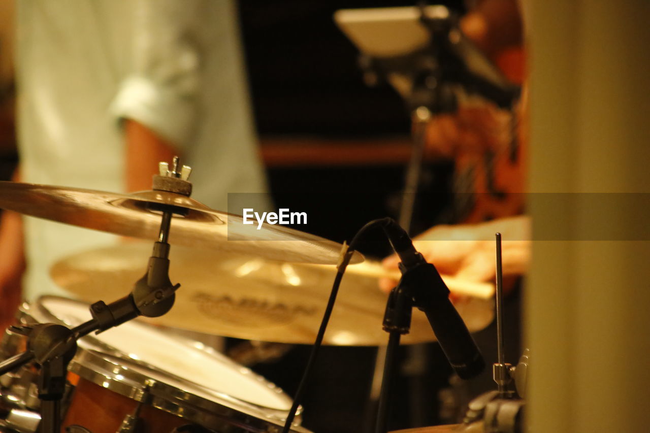 Microphone and drum kit in recording studio