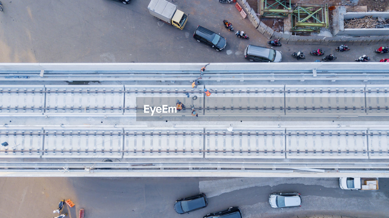 High angle view of workers working over bridge