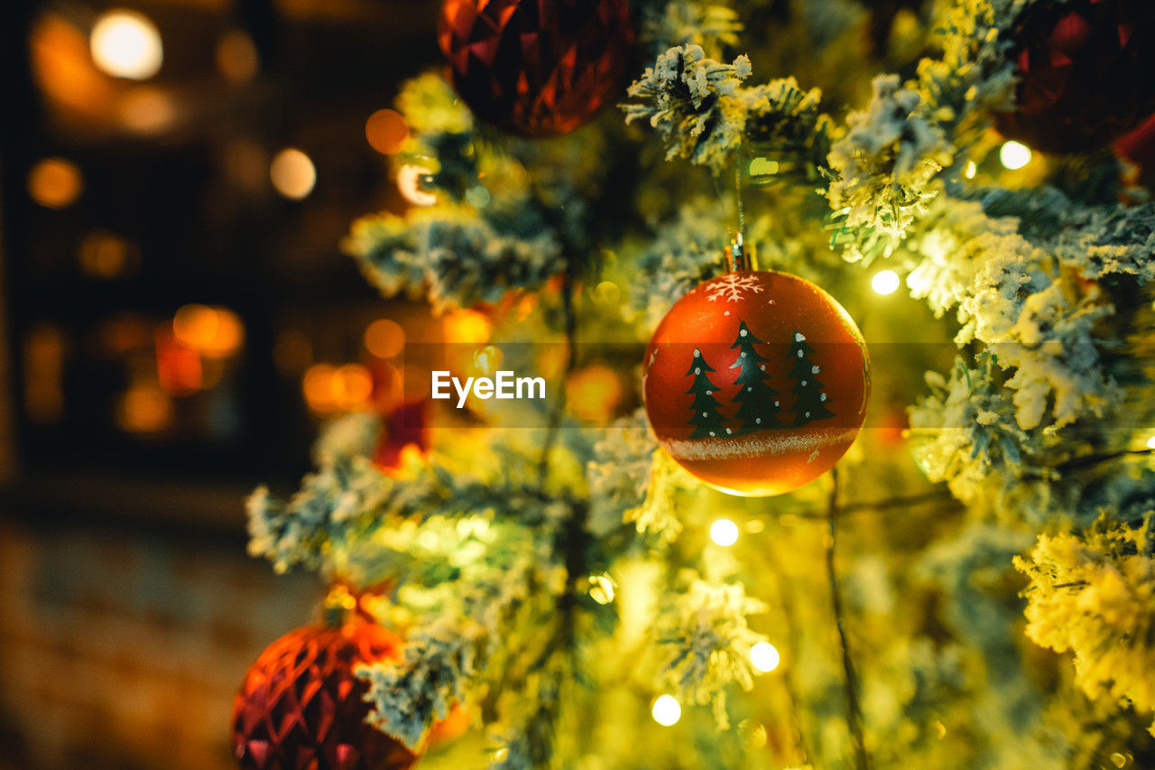 holiday, decoration, celebration, yellow, christmas tree, tradition, plant, tree, christmas, christmas decoration, illuminated, no people, flower, focus on foreground, nature, christmas ornament, close-up, hanging, night, christmas lights, multi colored, sphere, outdoors, selective focus, event, macro photography