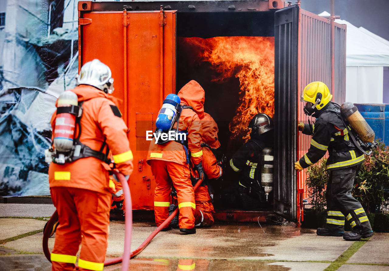 Figters against fire in container