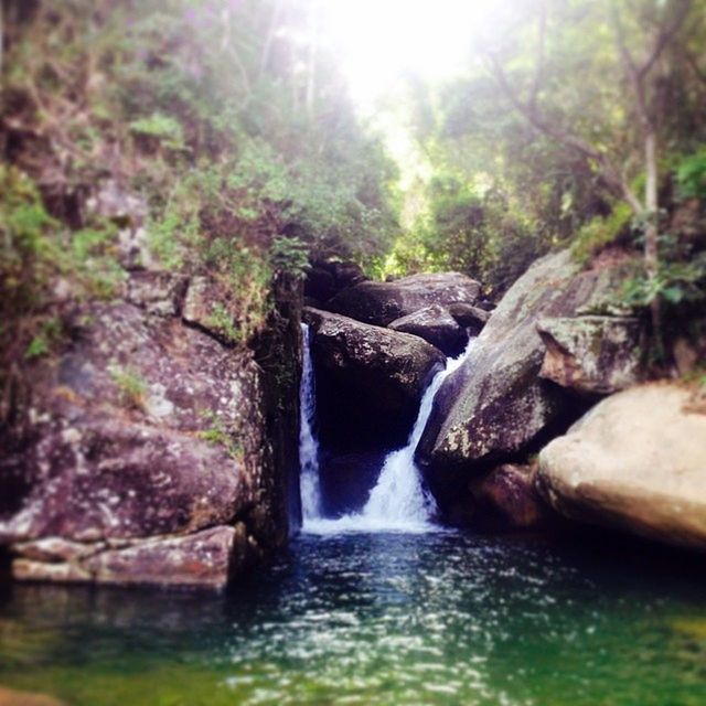 STREAM FLOWING THROUGH ROCKS