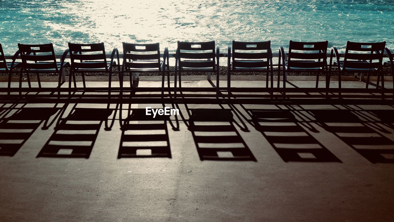 High angle view of chairs at beach