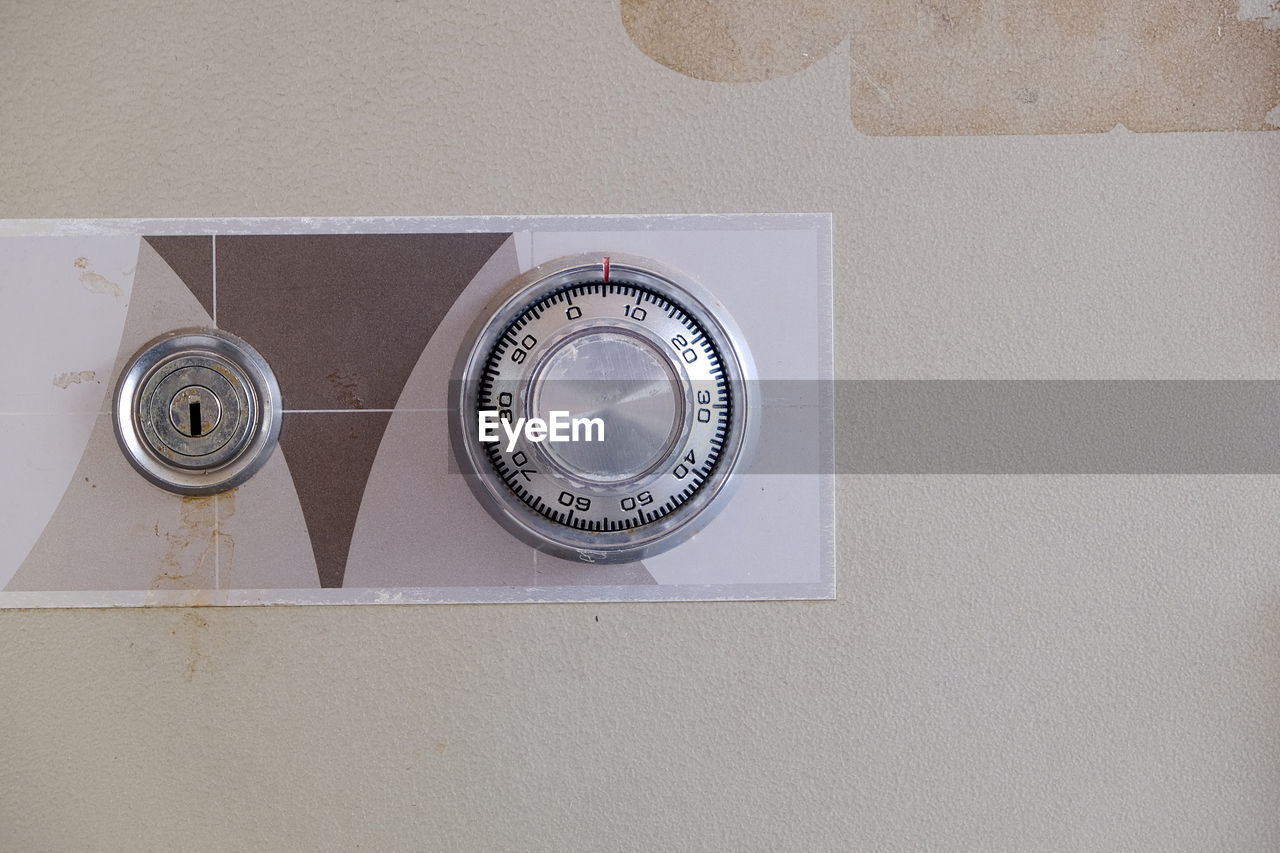 CLOSE-UP OF ELECTRIC FAN ON WALL