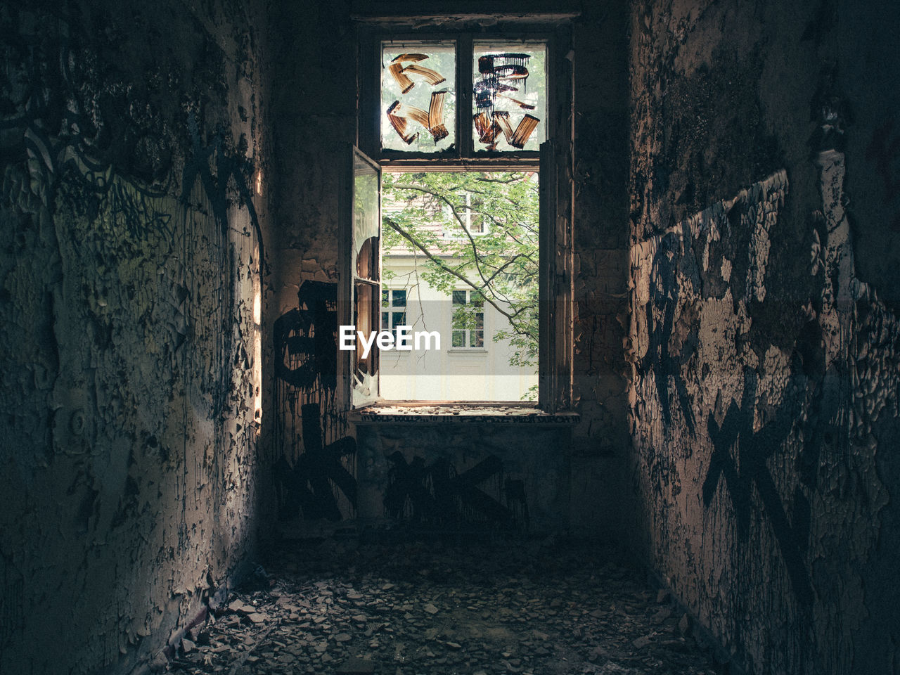 Window in abandoned damaged room