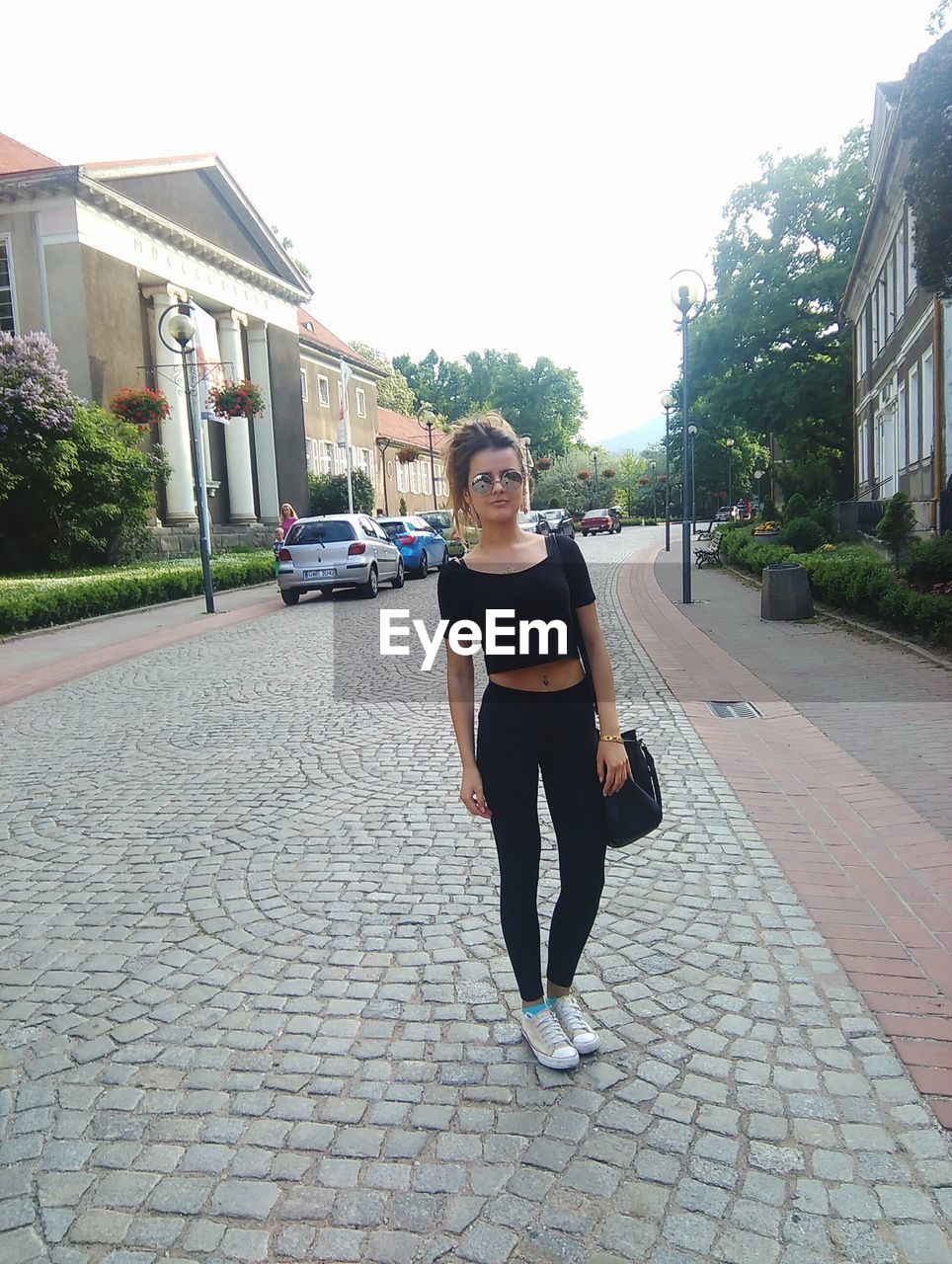 WOMAN WALKING ON ROAD