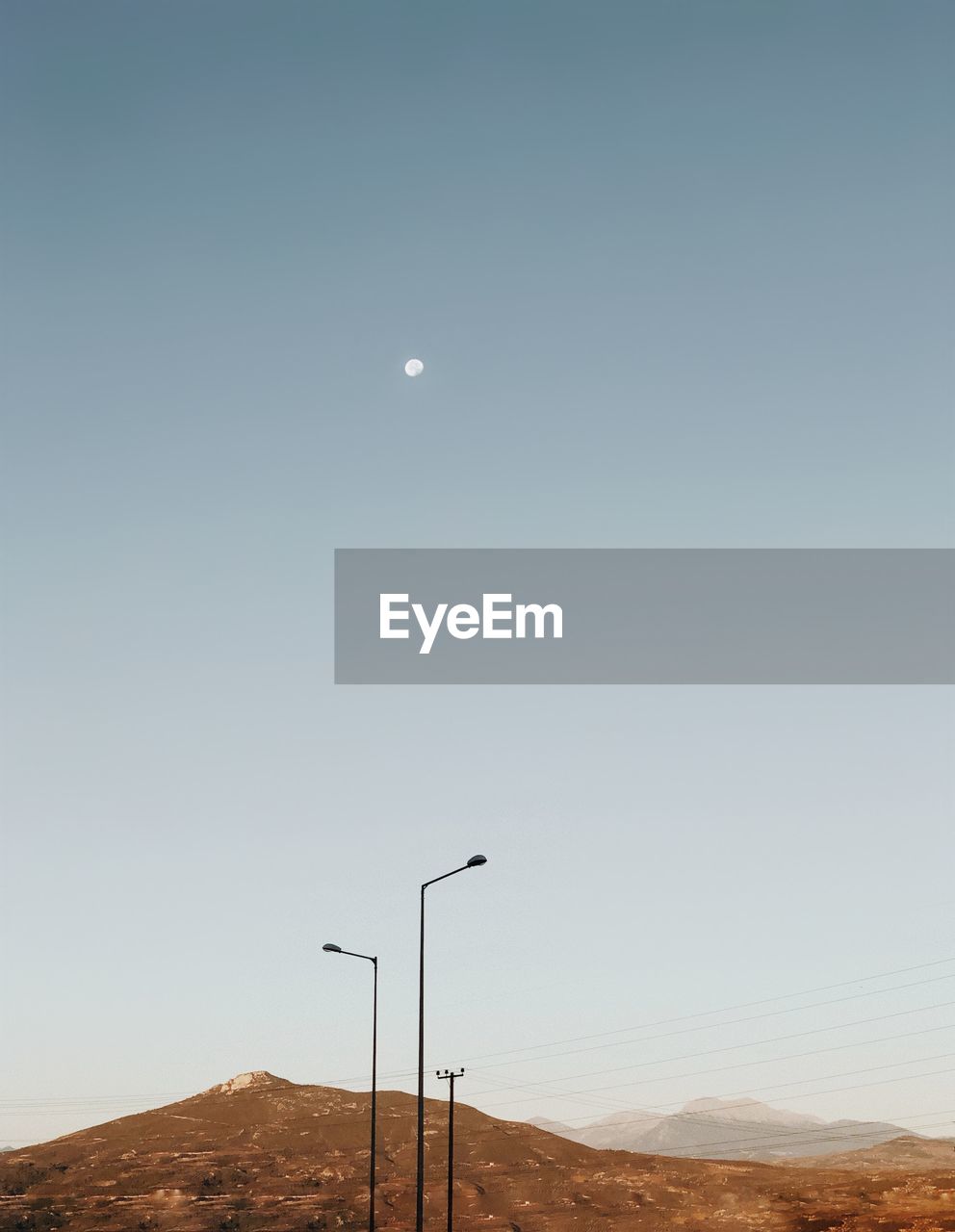 Street lights against clear sky